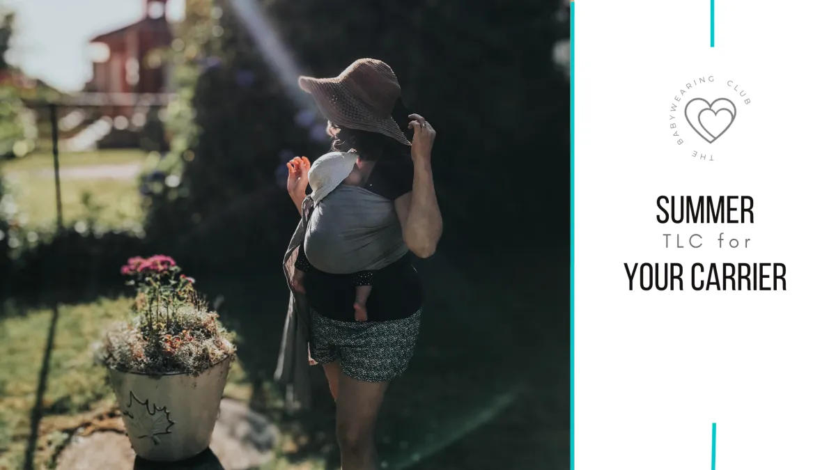 new mom carrying her newborn baby in a thin linen ring sling, they are both wearing wide brim hats and the sun is shining. baby carrier care in the summer