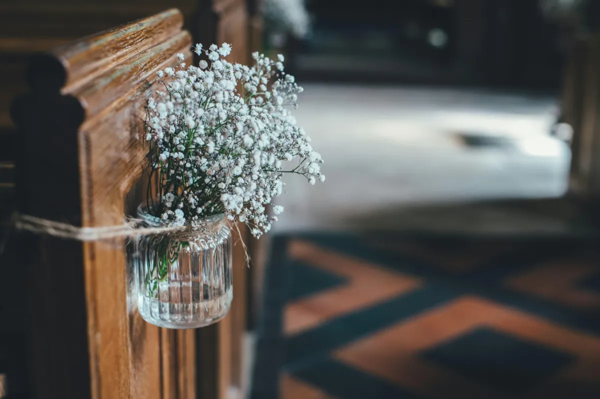 simple elegant wedding flowers at a church