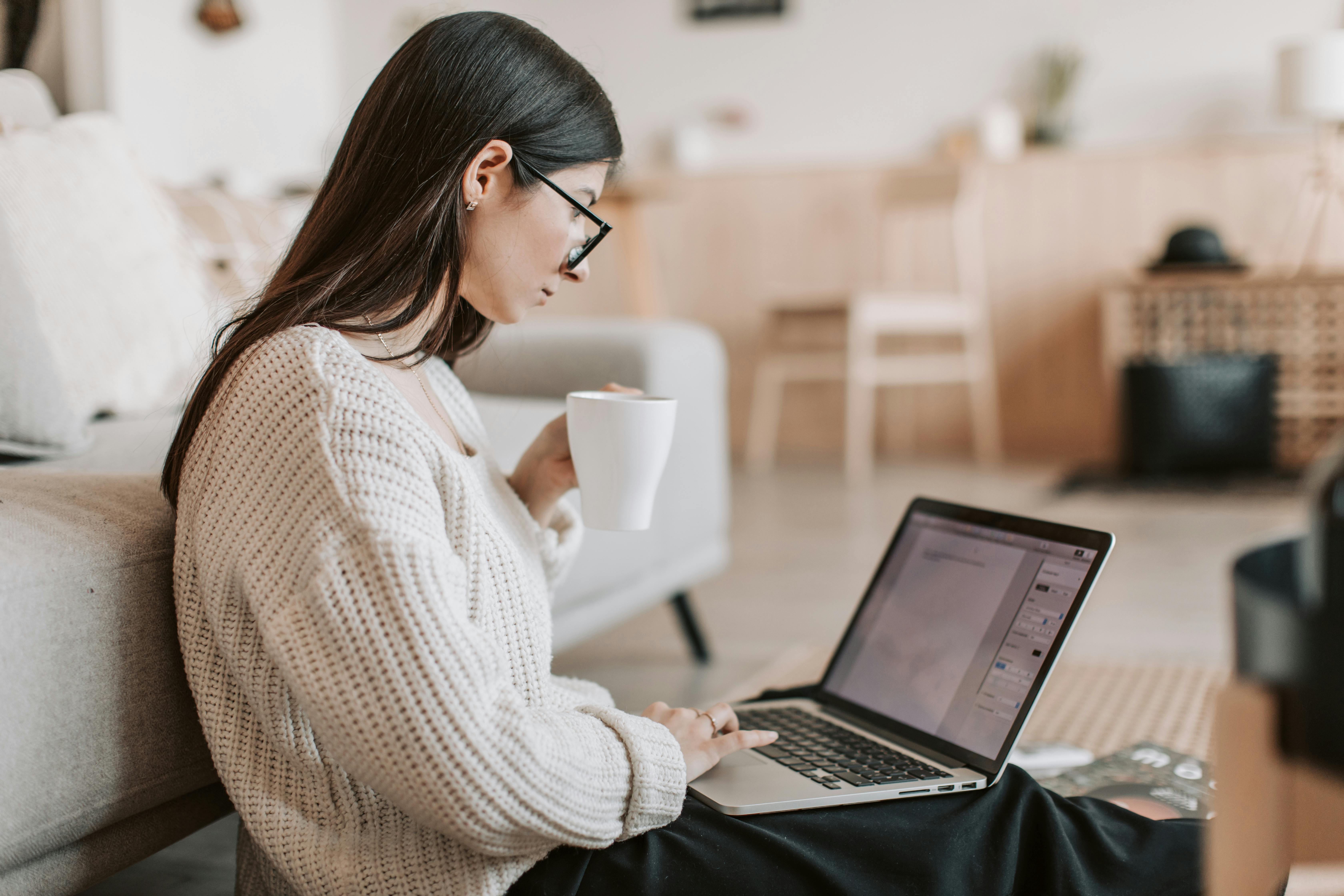 Woman looking at laptop