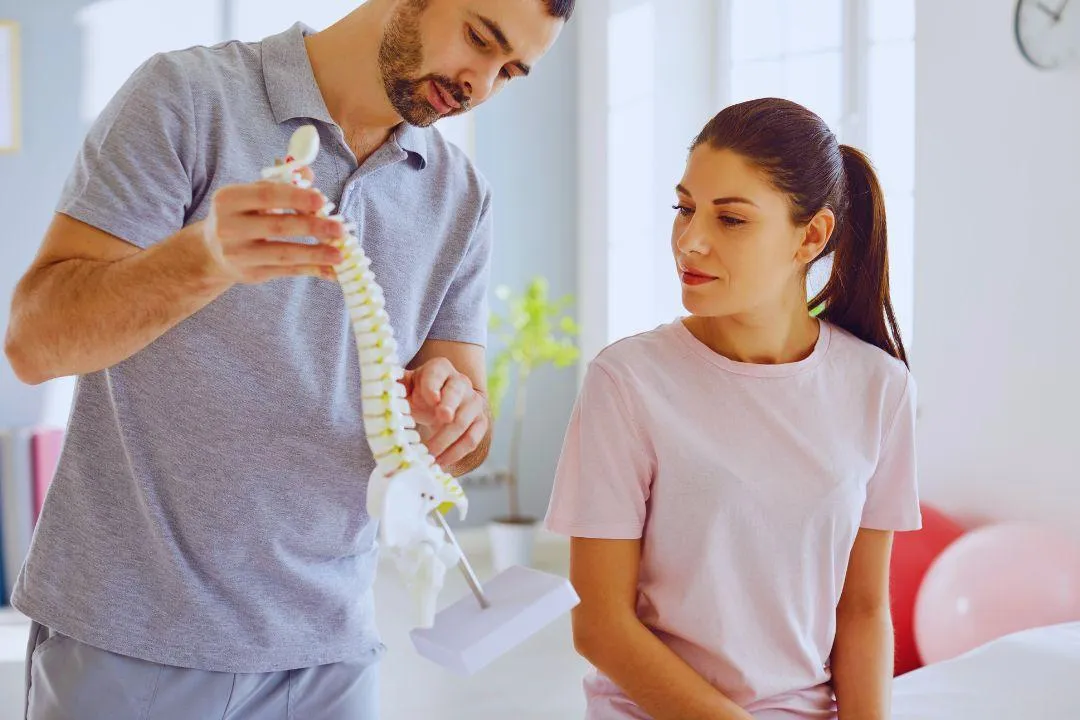Female patient consulting with a chiropractor