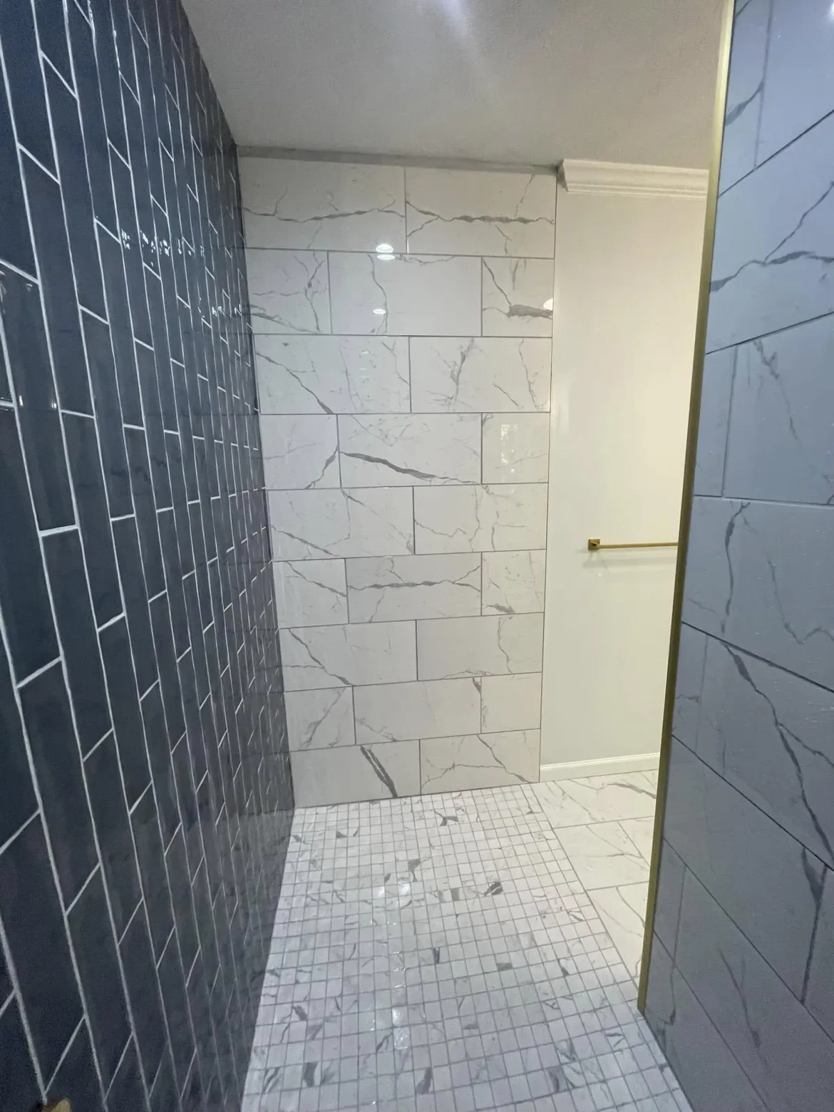 Detail view of tile pattern and grout lines in Columbia County bathroom remodel