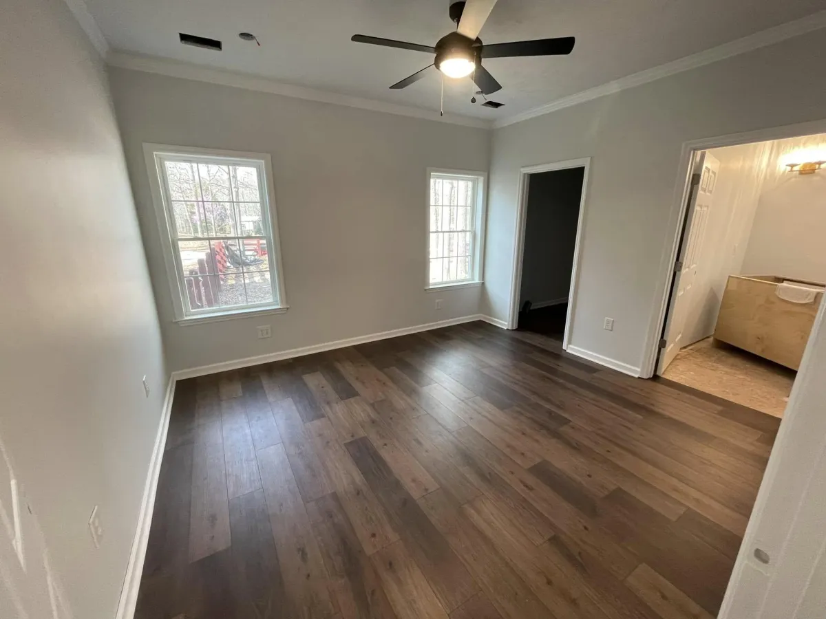 Installation of luxury vinyl plank flooring in compact kitchen space by Lakeside