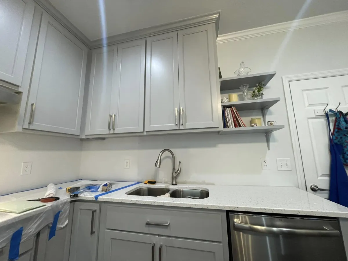 Upper and lower cabinets installed in kitchenette space by Lakeside Construction