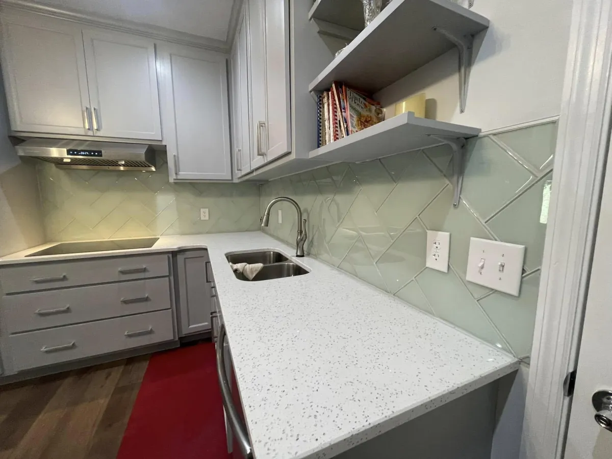 Kitchenette with open shelving and tile backsplash in Evans GA home addition