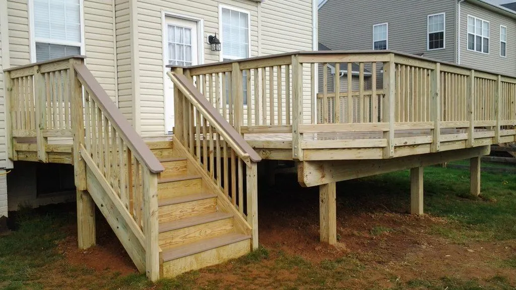 Wood deck with railing by Wyatt Built in Troutman NC