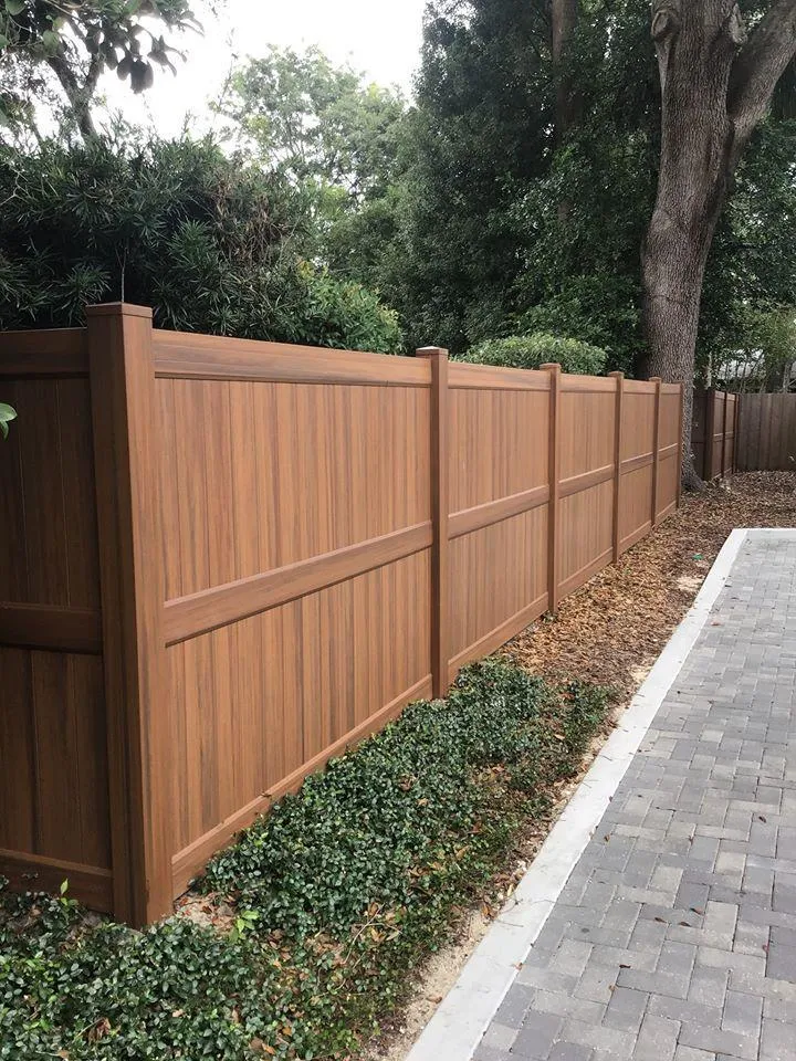 Tan vinyl privacy fence by Wyatt Built in Davidson NC