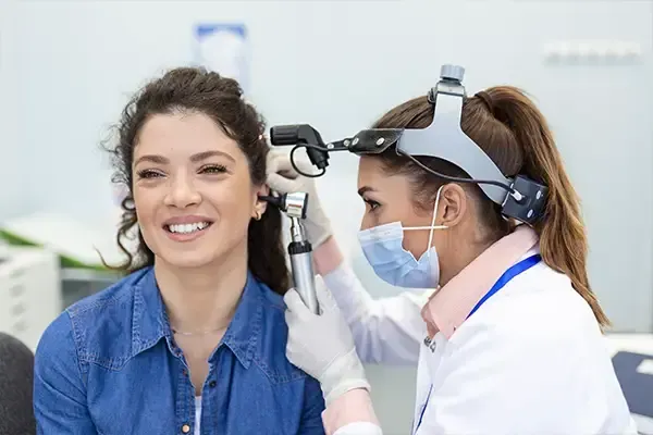 woman taking a hearing examination