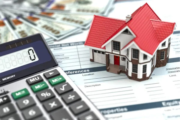 Build wealth in Michigan with real estate investing graphic showing a calculator and a house