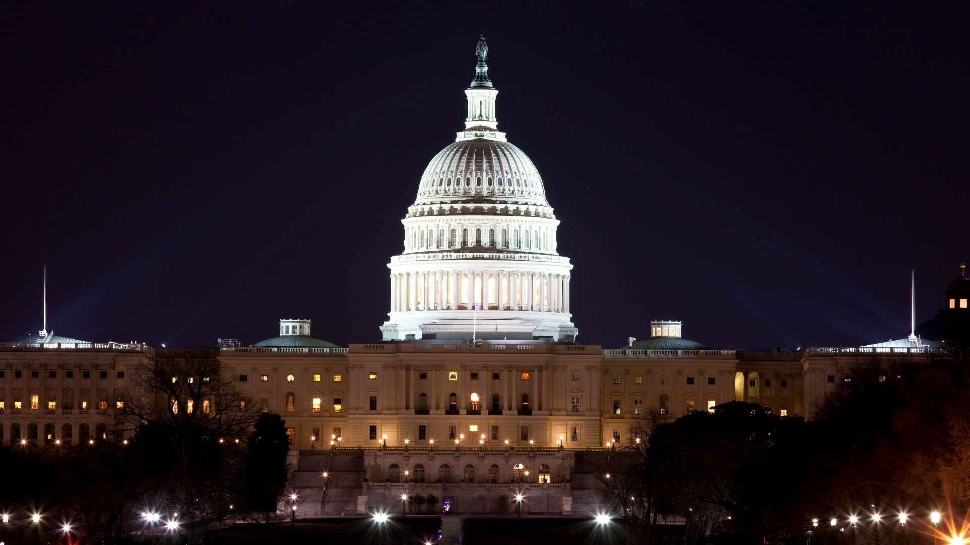 The U.S. Capitol Building is lit up at dusk.