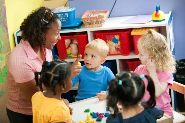 a woman teaching children