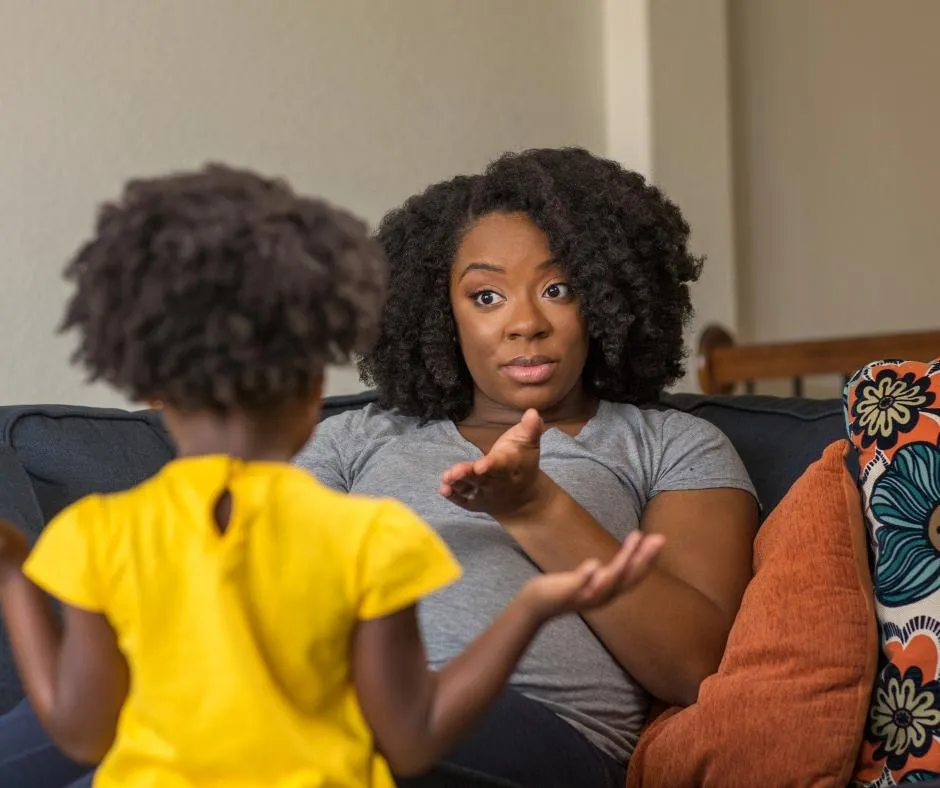 a mother talking to a child