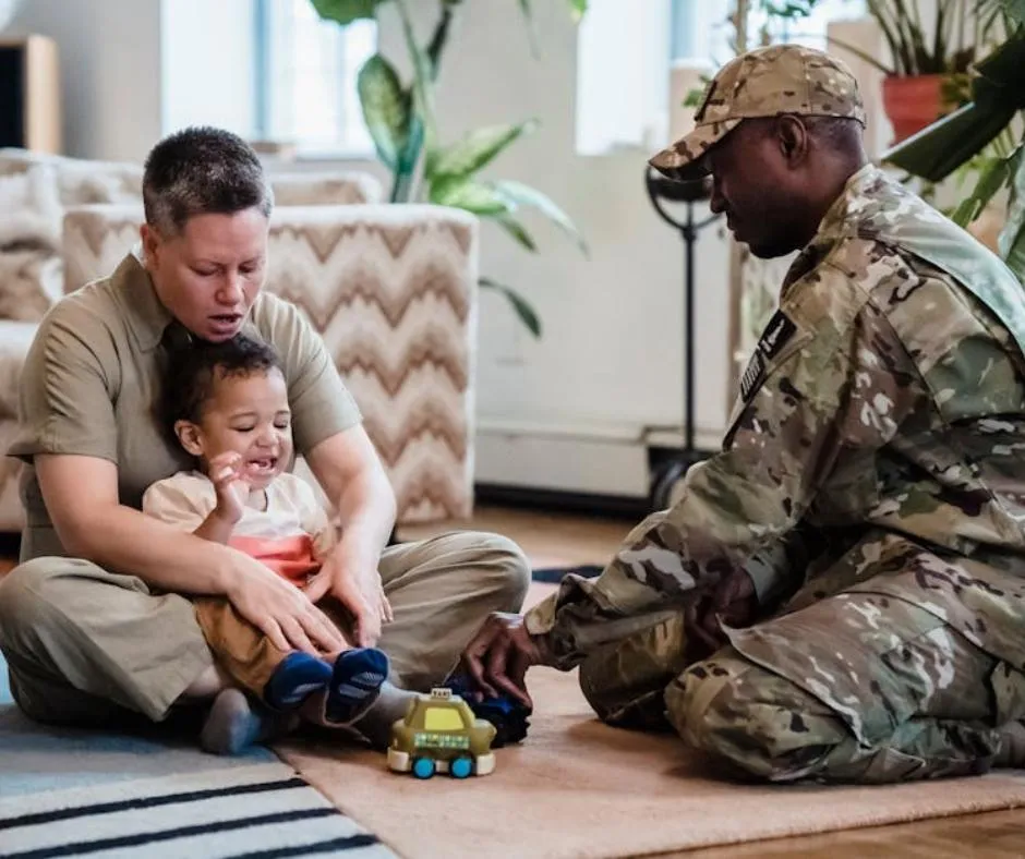 a man and a woman playing with their kid
