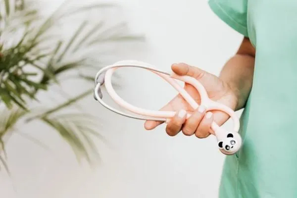 doctor holding stethoscope