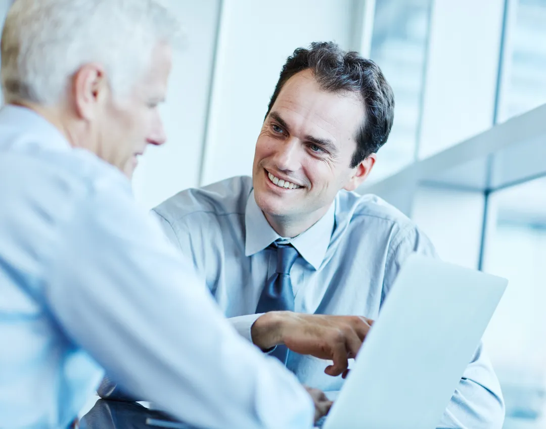 Two businessmen having a discussion in an office.