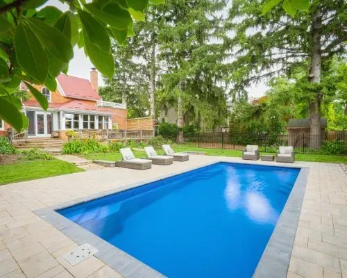 Outback Dundee Barrier Reef Fiberglass Inground Pool in a backyard in Indianapolis Indiana by Jensen's Pools and More