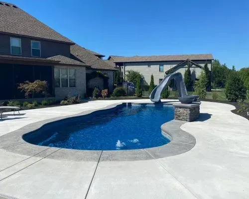 Billabong Cove Barrier Reef Fiberglass Inground Pool in a backyard in Indianapolis Indiana by Jensen's Pools and More