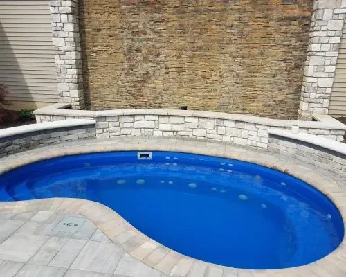 Crispin Plunge Barrier Reef Fiberglass Inground Pool in a backyard in Indianapolis Indiana by Jensen's Pools and More
