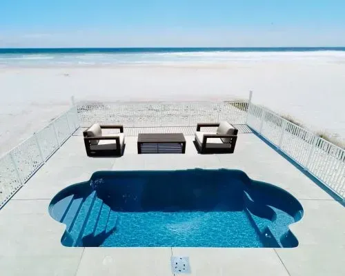 Milano Barrier Reef Fiberglass Inground Pool in a backyard in Indianapolis Indiana by Jensen's Pools and More