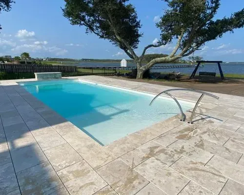 Bondi Barrier Reef Fiberglass Inground Pool in a backyard in Indianapolis Indiana by Jensen's Pools and More