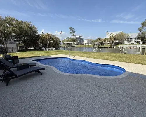 Billabong Splash Barrier Reef Fiberglass Inground Pool in a backyard in Indianapolis Indiana by Jensen's Pools and More