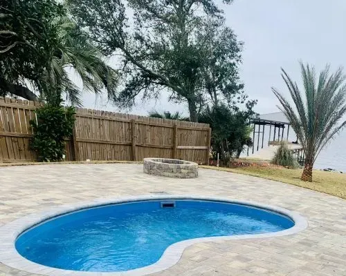 Pixie Plunge Barrier Reef Fiberglass Inground Pool in a backyard in Indianapolis Indiana by Jensen's Pools and More