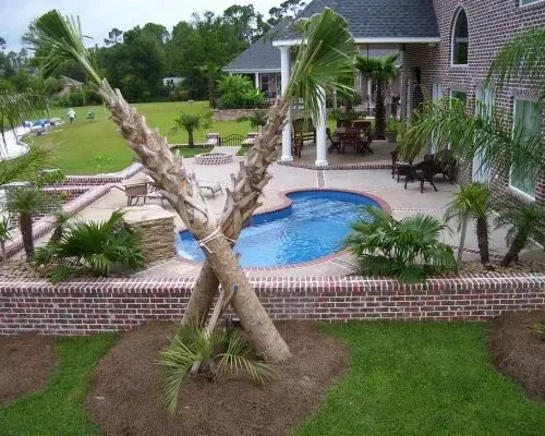 Opal Barrier Reef Fiberglass Inground Pool in a backyard in Indianapolis Indiana by Jensen's Pools and More