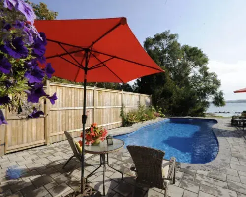 Southport Barrier Reef Fiberglass Inground Pool in a backyard in Indianapolis Indiana by Jensen's Pools and More