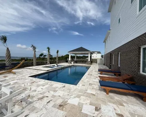 Whitsunday Barrier Reef Fiberglass Inground Pool in a backyard in Indianapolis Indiana by Jensen's Pools and More