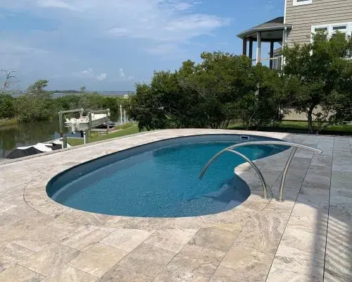 Oyster Barrier Reef Fiberglass Inground Pool in a backyard in Indianapolis Indiana by Jensen's Pools and More