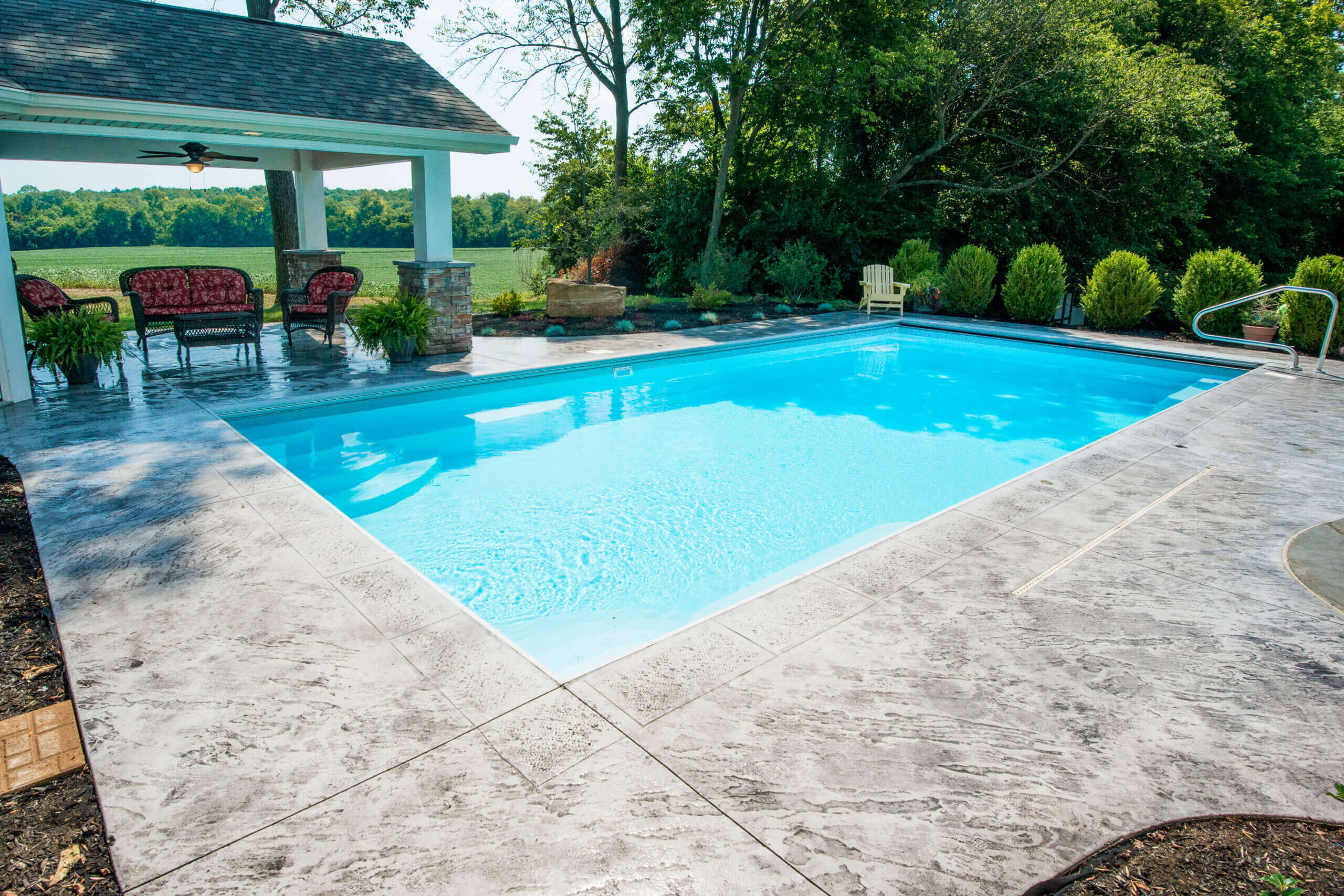 Goliath Thursday Pools Fiberglass Inground Pool in a backyard in Indianapolis Indiana by Jensen's Pools and More