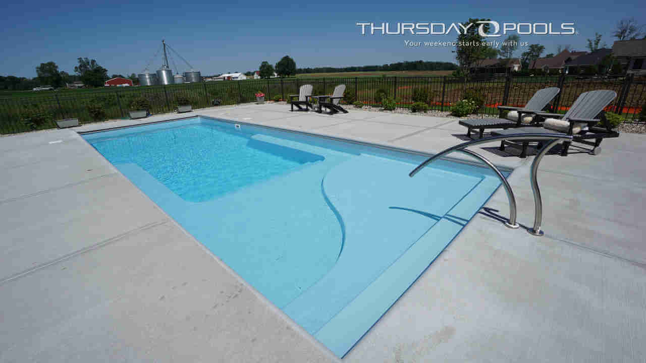 Lil Bob LX Thursday Pools Fiberglass Inground Pool in a backyard in Indianapolis Indiana by Jensen's Pools and More