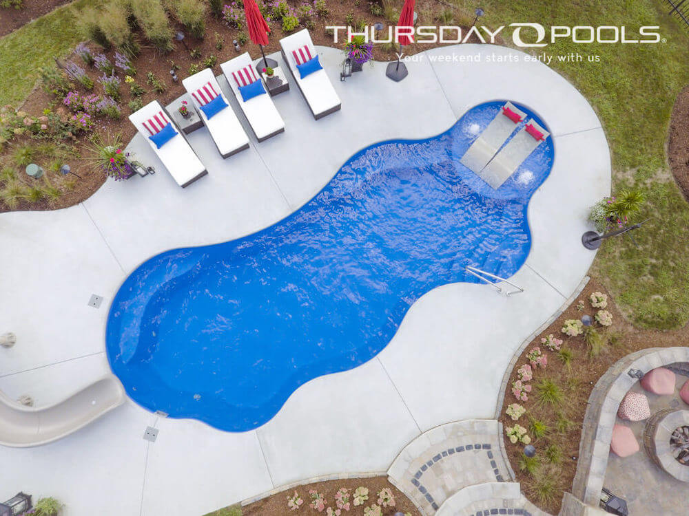 Wellspring Thursday Pools Fiberglass Inground Pool in a backyard in Indianapolis Indiana by Jensen's Pools and More