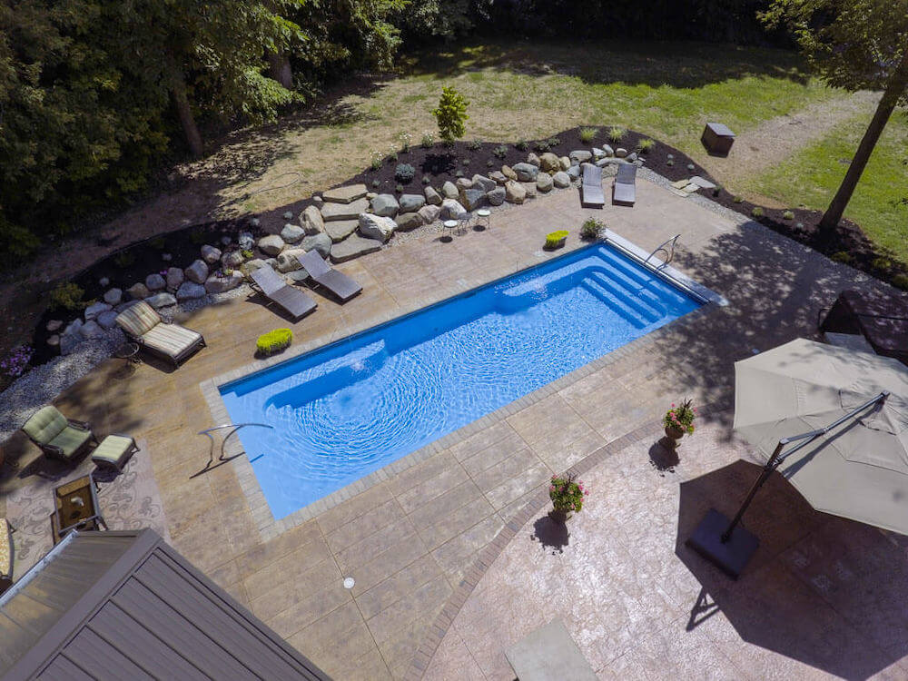 Spirit Thursday Pools Fiberglass Inground Pool in a backyard in Indianapolis Indiana by Jensen's Pools and More