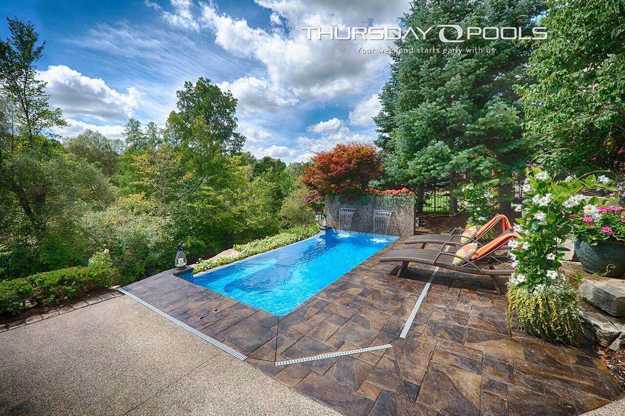 Sea Turtle Thursday Pools Fiberglass Inground Pool in a backyard in Indianapolis Indiana by Jensen's Pools and More