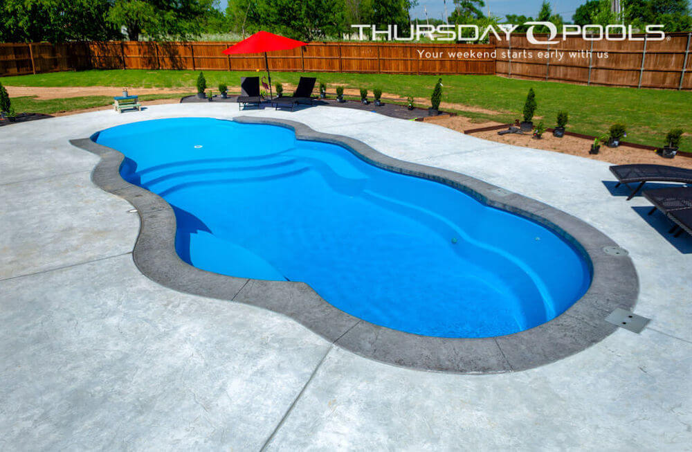 Sandal Beach Entry Thursday Pools Fiberglass Inground Pool in a backyard in Indianapolis Indiana by Jensen's Pools and More