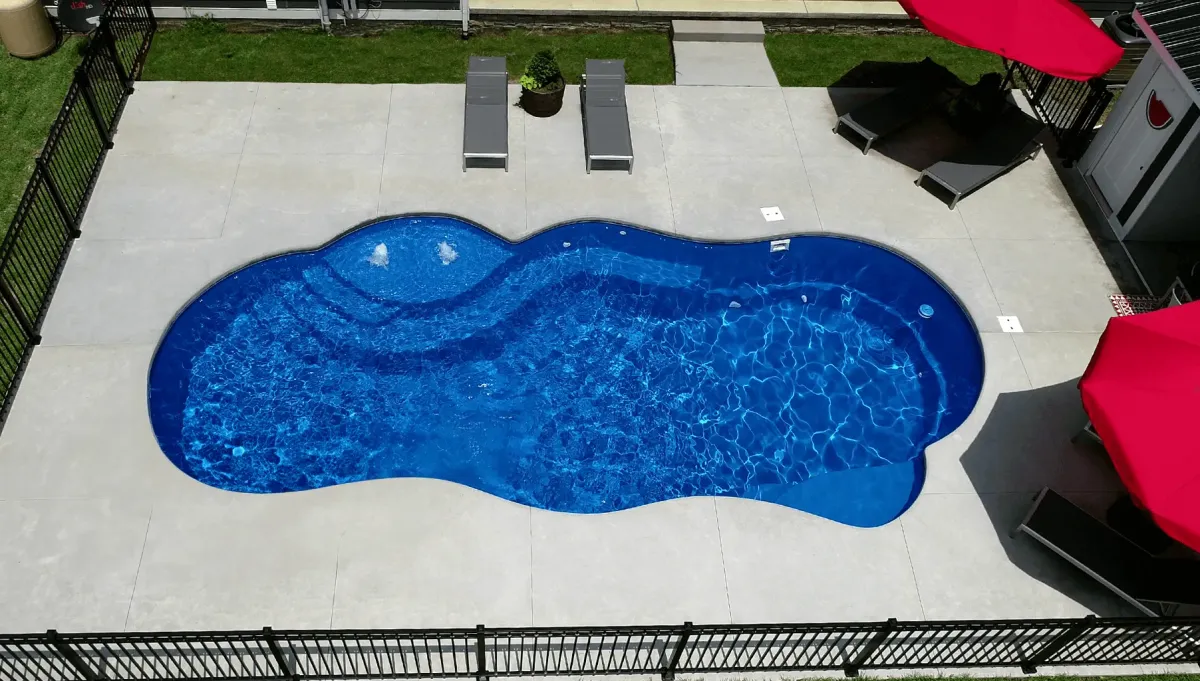 Sun Day Thursday Pools Fiberglass Inground Pool in a backyard in Indianapolis Indiana by Jensen's Pools and More