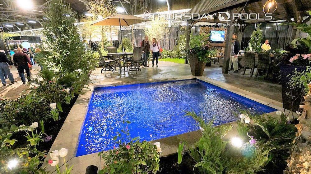 Wading Pool Thursday Pools Fiberglass Inground Pool in a backyard in Indianapolis Indiana by Jensen's Pools and More