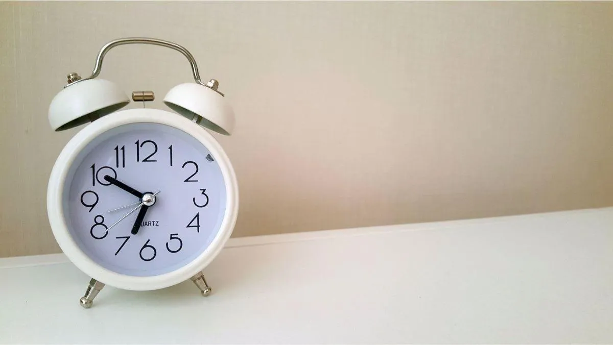 white clock on countertop