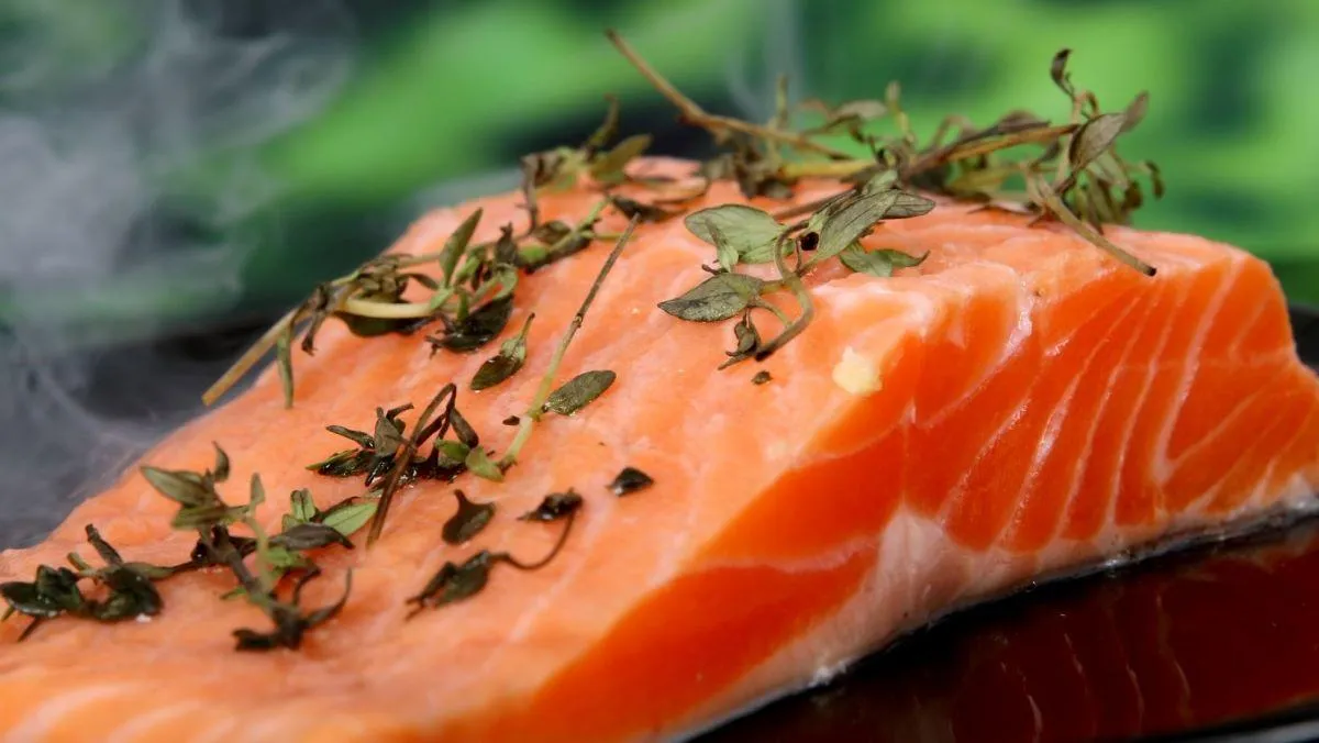 salmon topped with fresh herbs