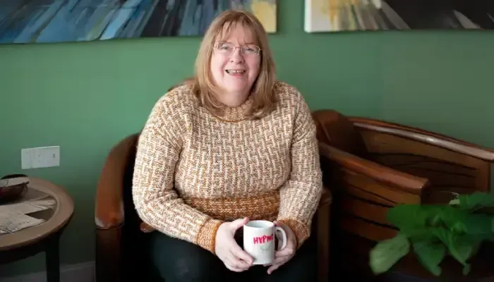 Kathryn Holding a HypnoGirl Mug