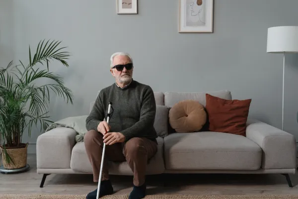 Blind person on couch
