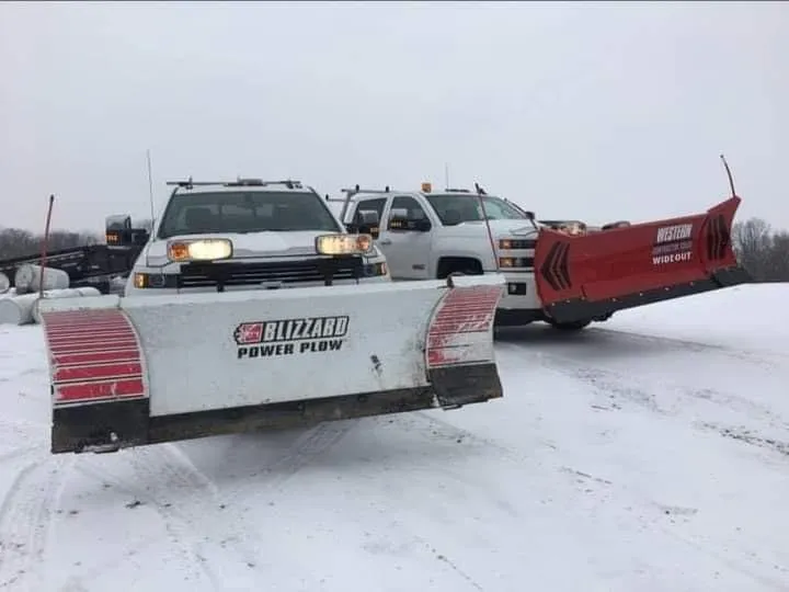Commercial snow removal truck and flat roof inspection in Central Pennsylvania winter