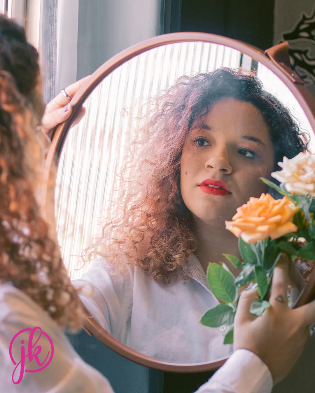 A woman looking in the mirror