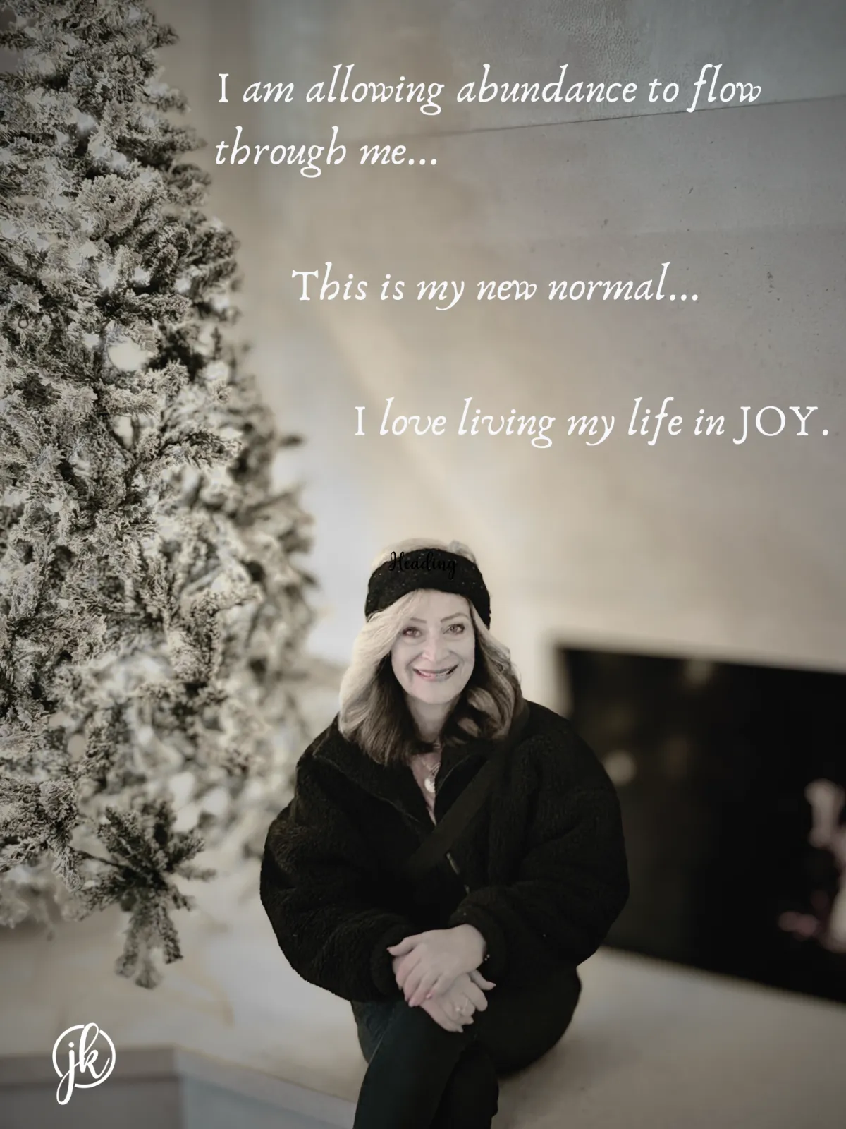 Julie in front of a christmas tree