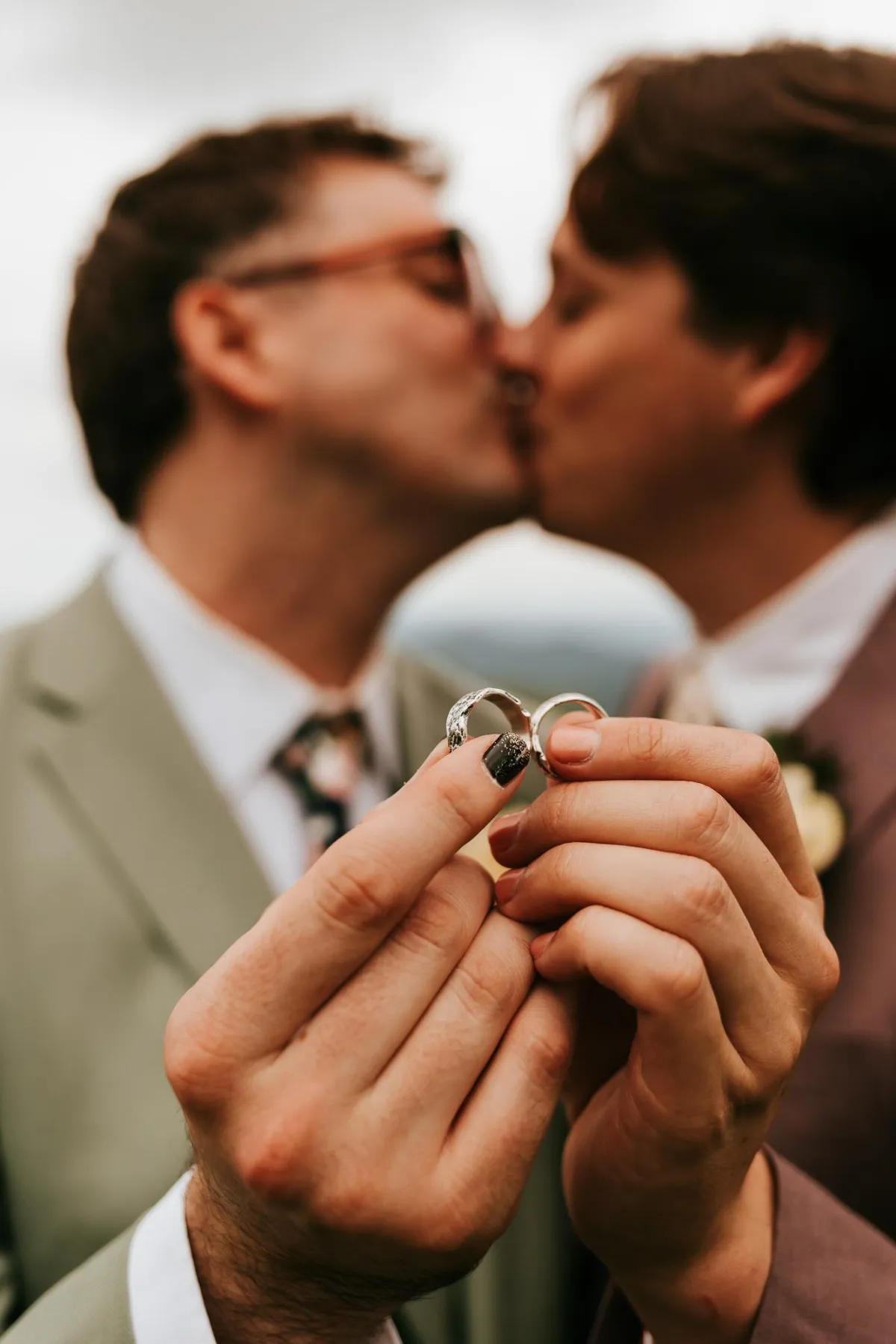 LGBTQ+ Friendly photographer taking photo of gay couple getting married