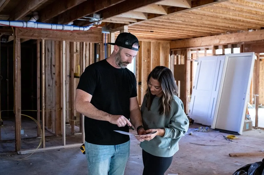 Beau and Julianne talking in a new build