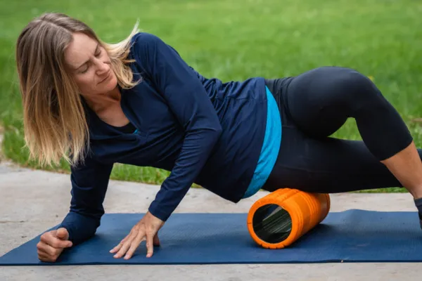Image of a volleyball player engaging in recovery activities, such as stretching, foam rolling, or getting a massage.