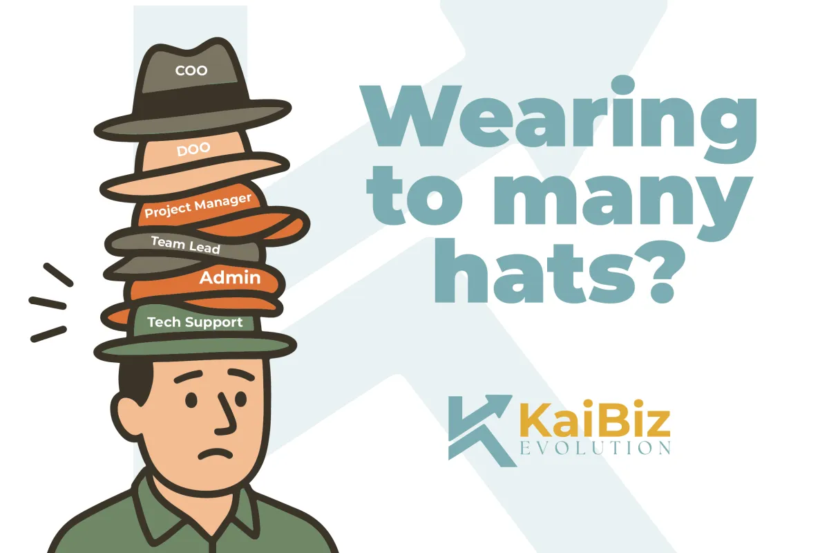 An illustration of a person with many hats stacked on their head, representing different roles like COO, DOO, Project Manager, Team Lead, Admin, and Tech Support. The text asks 'Wearing too many hats?' with the 'KaiBiz Evolution' logo below.