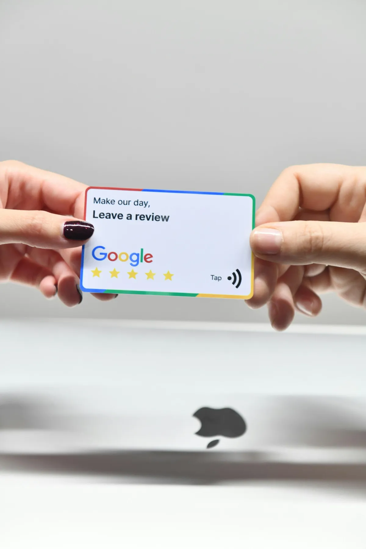 Small business owner asking satisfied customers to leave Google reviews to boost online reputation.