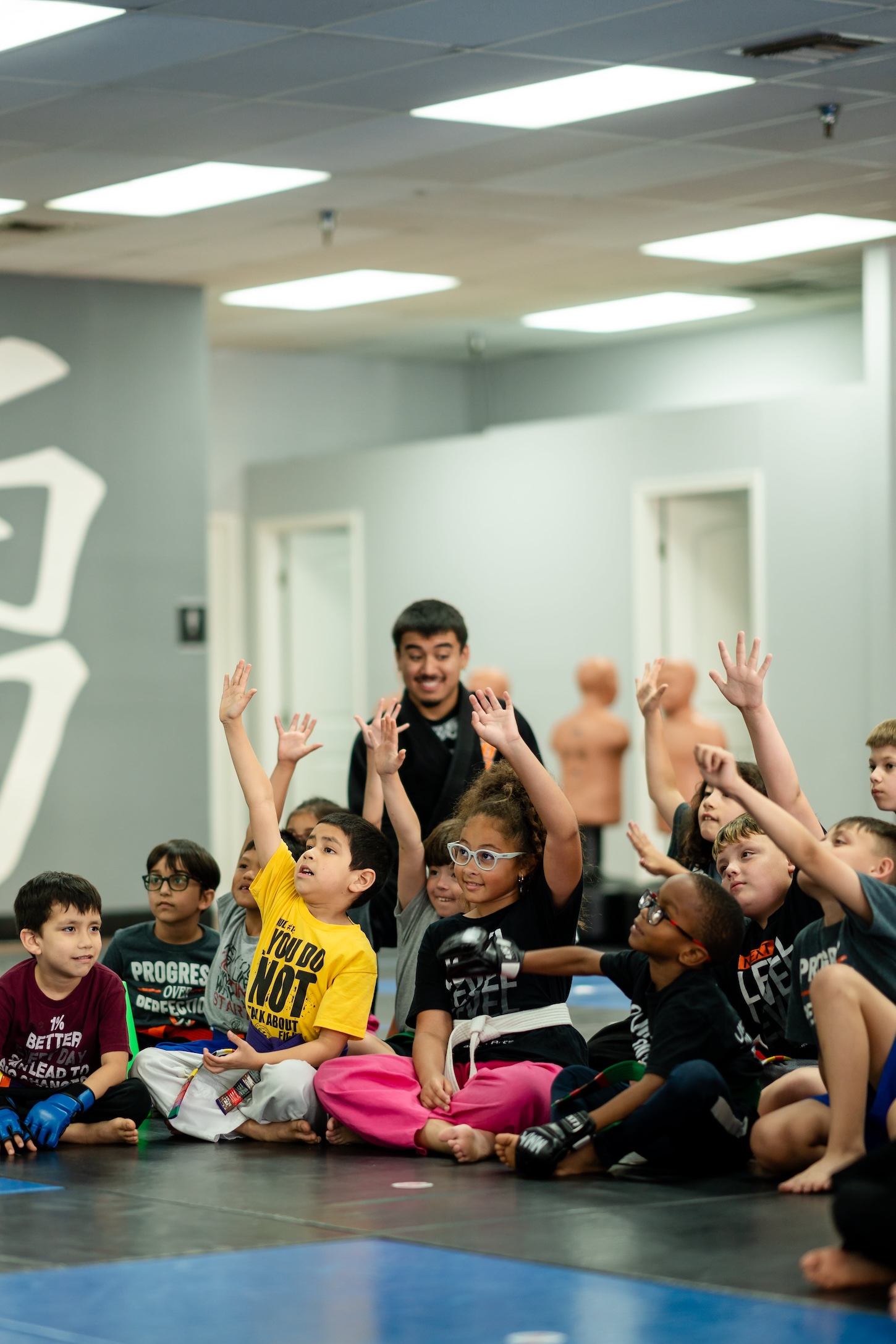 Kids in martial arts class hanging out